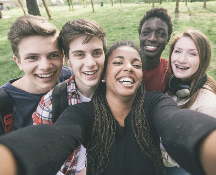 Teenagers standing around